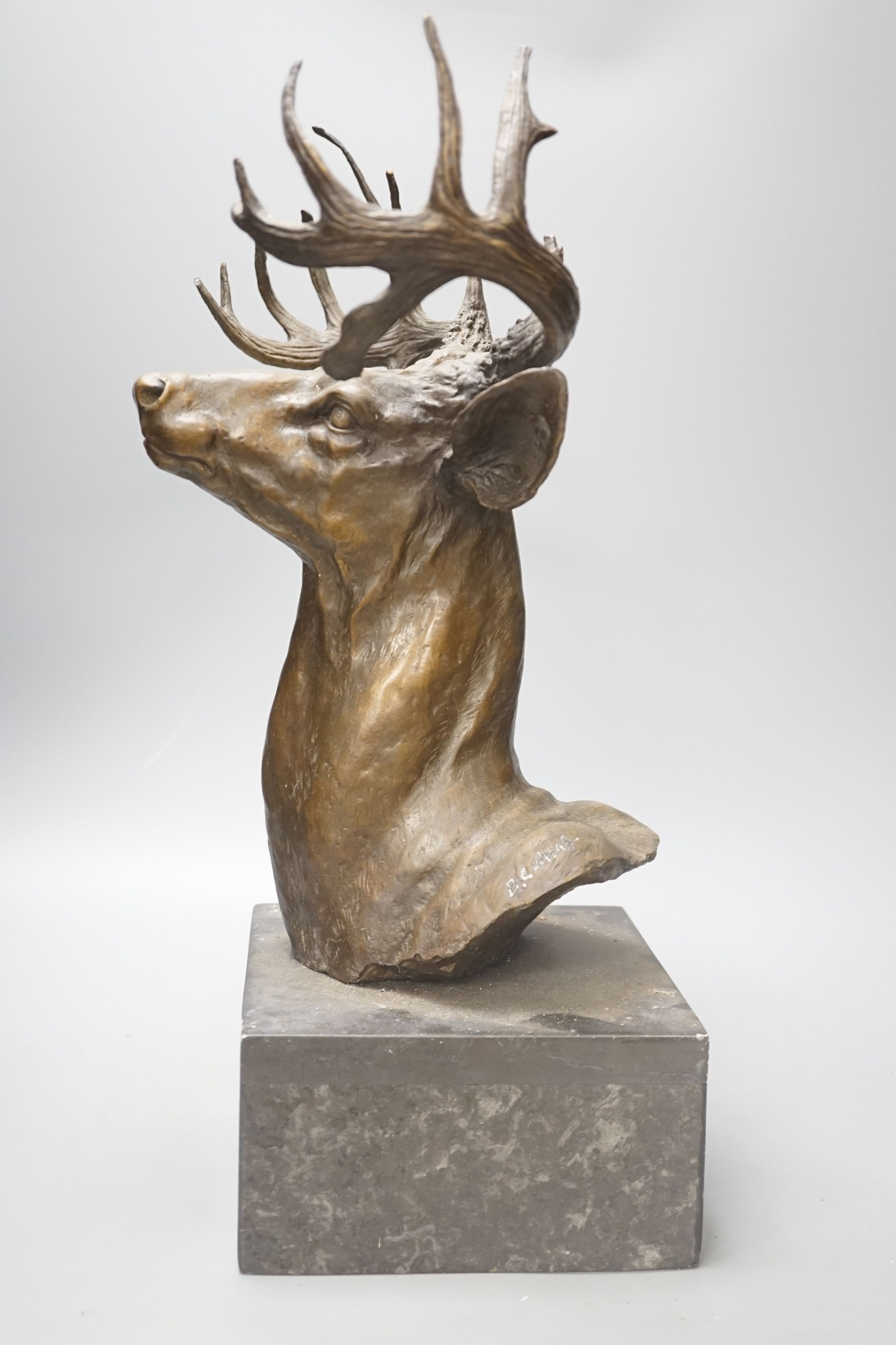 After B.C Zheng, bronzed metal model of a stag's head, 47cm